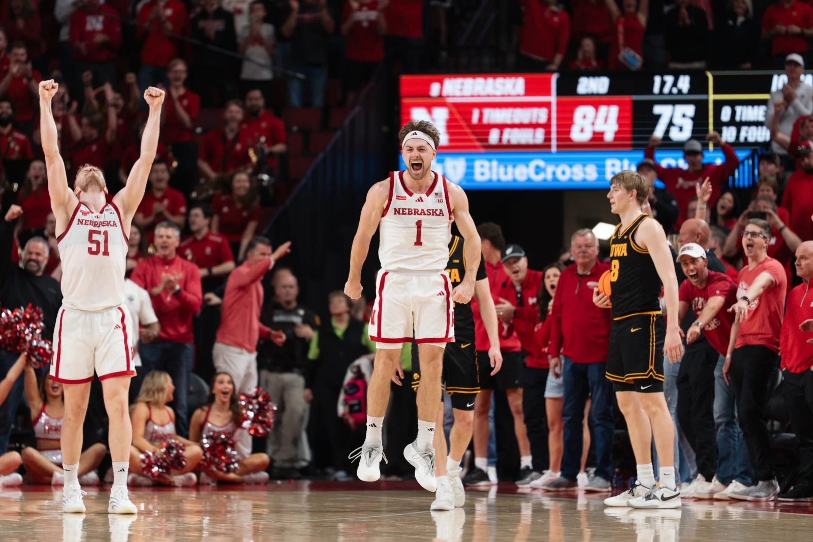 Nebraska guard Sam Hoiberg (1) and forward Rienk Mast (51) celebrate in the final seconds of overtime against Iowa at Pinnacle Bank Arena in Lincoln, Neb., Sunday, March 8, 2026. Nebraska won 84-75 for its 26th win, tying the program record.