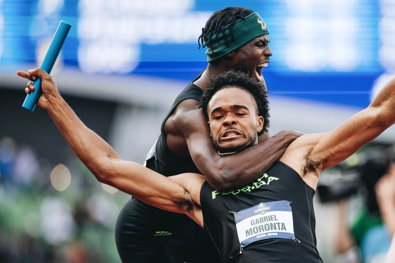 A South Florida teammate tackles Gabriel Moronta, front, after Moronta anchored the Bulls to the men's 4x400-meter relay title at the NCAA Outdoor Track and Field Championships at Hayward Field in Eugene, Ore., Friday, June 13, 2025. The teammate ran onto the track before the race was over, and the result was protested, but the Bulls were not disqualified. Their program-record 3:00.42 gave South Florida its first national title.